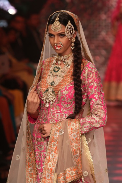 Gorgeous in bridal attire a model strikes a pose at Birdichand Show Day 3 IIJW 2015.jpg
